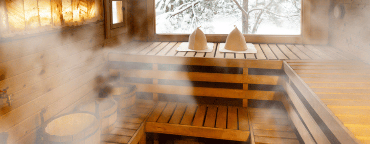 residential steam room with elegant tiled seating and ambient lighting